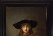 International Friends of Kunsthistorisches Museum Vienna: Exhibition Tour & Evening Lecture / Kulturforum New York Das Bild zeigt ein Gemälde des Barockmalers Rembrandt. Das Gemälde bildet ein Mädchen mit Hut ab, das aus einem Bilderrahmen herausschaut bzw. herausgreift.