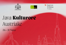 Österreichische Kulturwoche in Albanien / Botschaft Tirana Das Bild zeigt eine mit einem Strich gefertigte Zeichnung der Stadt Wien mit dem Stephansdom und weiteren herausstechenden Gebäuden vor einem roten Hintergrund.